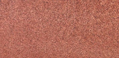 Kharda Red Granite slab &mdash; deep burgundy-red to wine with cream quartz and dark mica inclusions